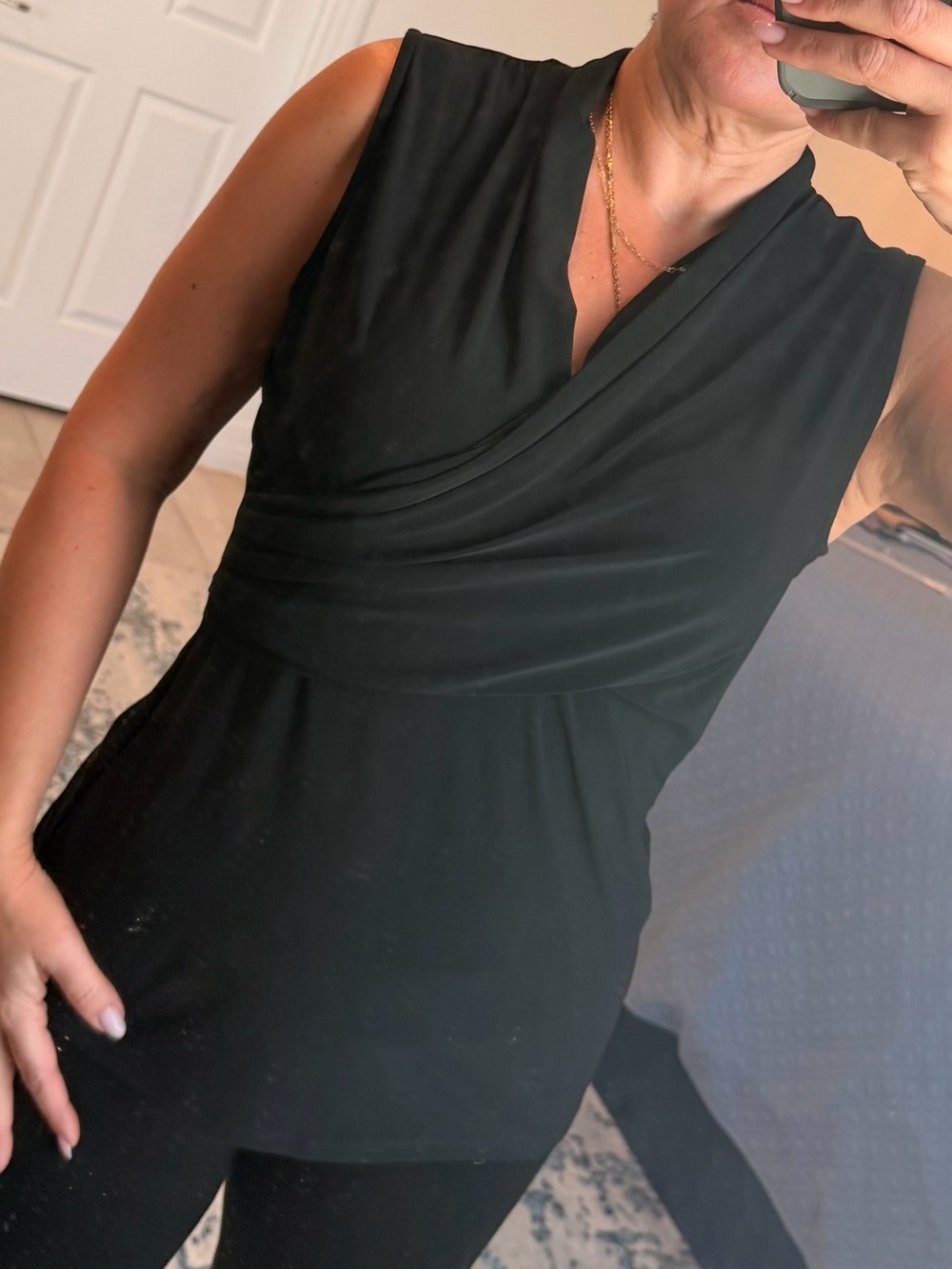 DKNY sleeveless crossover faux-wrap top.